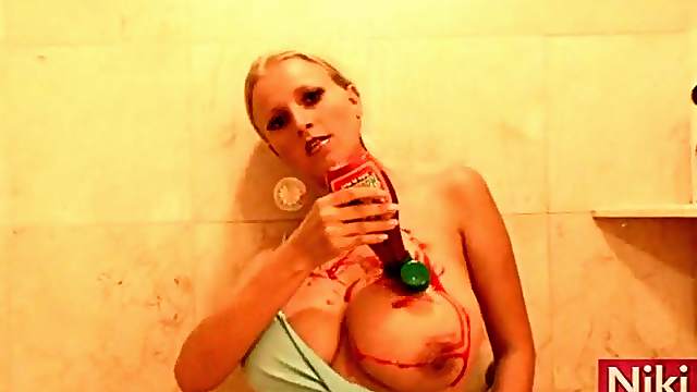 Niki Castro pours strawberry sauce on her titties