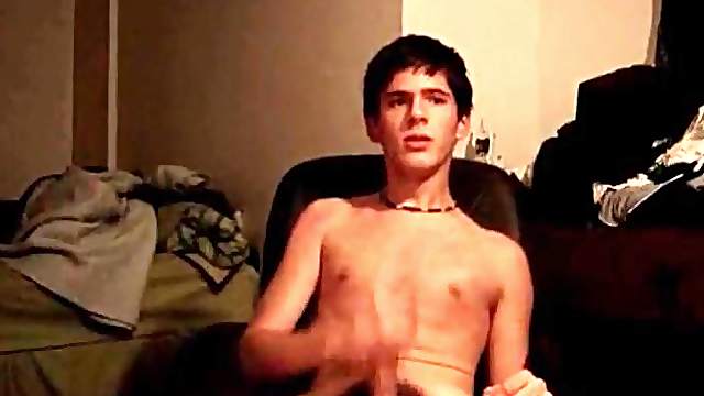 Twink cutie strokes his cock in office chair