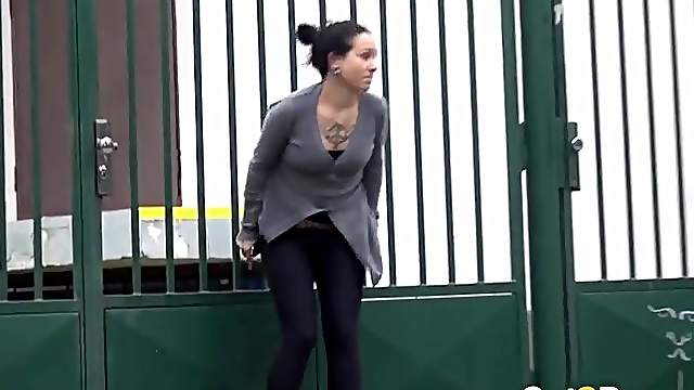 Tattooed girl pees in a driveway in public