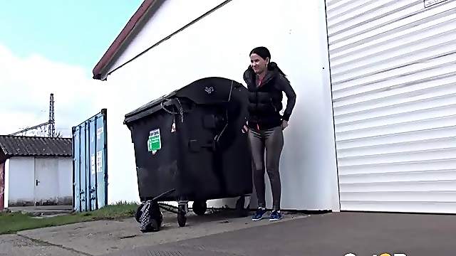 Shiny leggings girl pees behind a dumpster