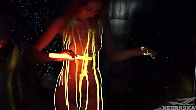 Beauty pours glow stick liquid all over her tight body
