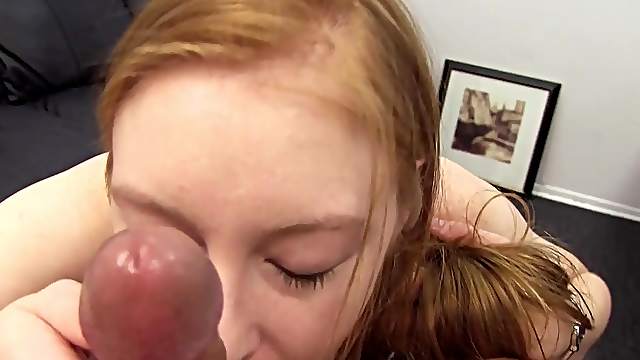 Curvy cock swallowing redhead fucked over a desk