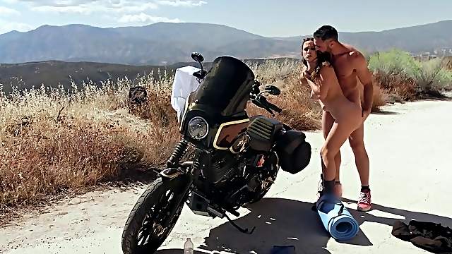 Babe bends over a motorcycle and gets fucked outdoors