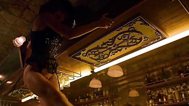 Sexy bartender does a lingerie striptease at work