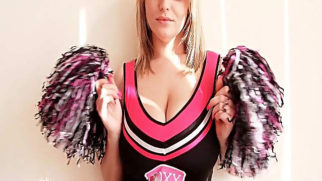 Cheerleader does a sexy striptease to show tits
