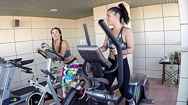 Amateur bitches share dick during their workout without knowing they are being filmed
