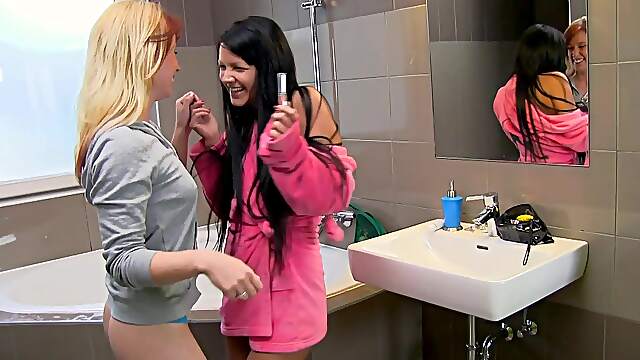 Skinny Minnie Manga gets her tight pussy fingered in the bathroom by babes.