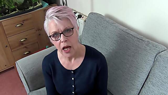 A mature woman with short hair fucks with her husband in pov style