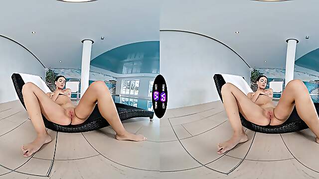 A stunning brunette, Vixi Rafi, enjoys solo play in a captivating vr scene.