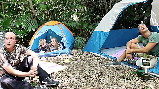 Alyssa and Haleydog it in the woods with Jimmy