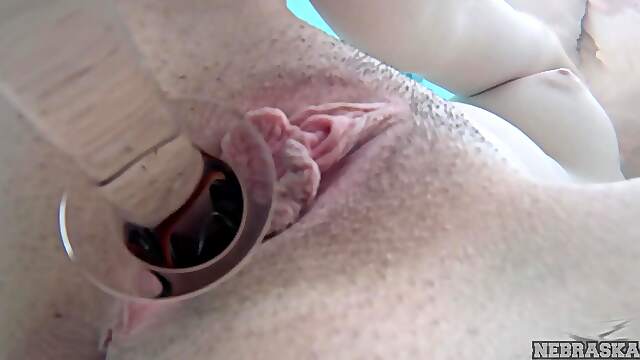Teeny Muna pleasures her smooth shaven pussy with toys by the pool