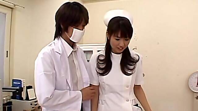 Naughty Japanese Nurse Misato teases in her uniform and high socks