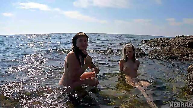 Skinny teens with tiny boobs show off their ink at a hot beach