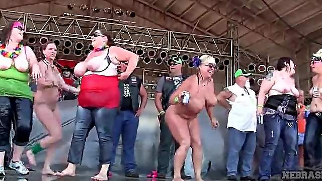 Chubby topless amateurs dancing on concert stage