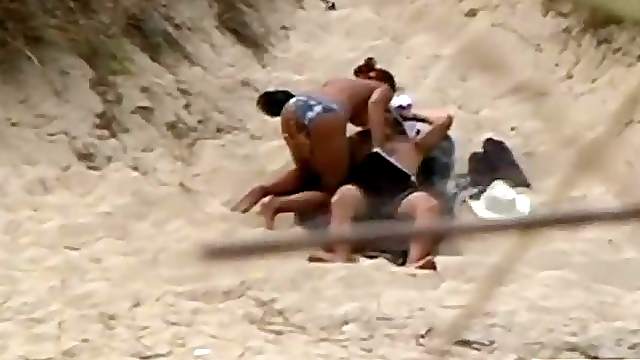Hot couple caught having sex on the beach